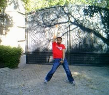 Sidow Sobrino poses grabbing his crotch outside 100 N Carolwood Drive, Los Angeles, CA 90077 The Mansion Michael Jackson died in
