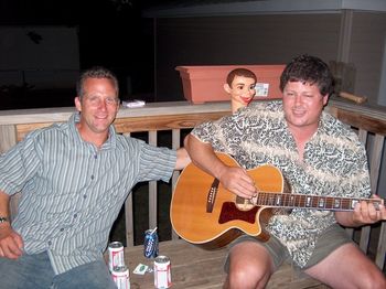Just for fun -- Jamming with my good friend, musician Sean Ryan, and his little wooden buddy (see above shoulder) after a summer '05 gig at the Iowa State Fair. If those beers could talk...
