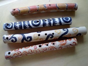 Pacific Island Nose Flutes painted with natural pigments we made!!! Grades 4 & up
