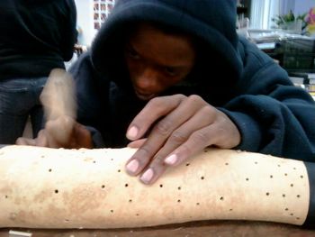 This is another of my homiez totally involved in making the Gourd Rain Stick!
