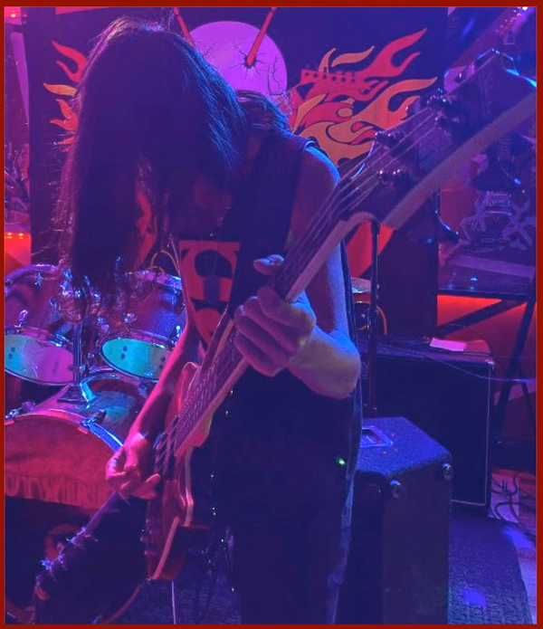 Jonny B. Bad rockin' on bass guitar!

