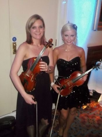 Violin duo: Emily and I at The Culloden Hotel event with Martin Toal, opera singer
