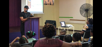Emperor reading his book to the youth for Story Telling Day at Kingston Library (2)
