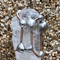 Crystal with copper tone guitar string wrap