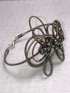 Twisted and tied guitar string bracelet