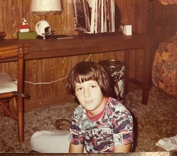 Me at 11 years old. Dig my Spiderman shirt and Dolphin lamp in background
