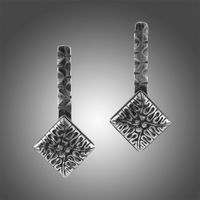 Handcrafted Antiqued Sterling Silver carved earrings with posts.