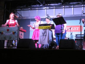 Three ladies who have been following the band for 10+ years join in playing cowbells at Wurstfest 2018   Photo by Janice
