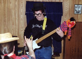 Googly Moogly lays down some slick bass on an early Baxter recording circa 1996, as producer Skid Baxter gives an enthusiastic "Dio" signal.
