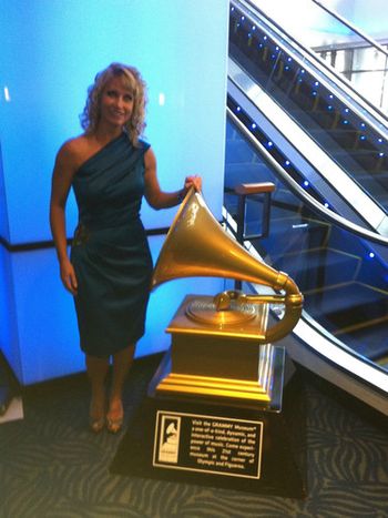 Jill posing with the Grammy Award statue at the Nokia Theatre
