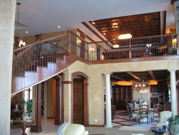 Check out the wood coffered ceiling on the 2nd floor. See how the finish on the curved staircase relects the light.
