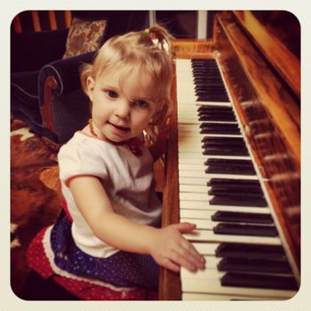 granddaughter Ruby Rae, age 2, at Grandpa Thomason's piano

