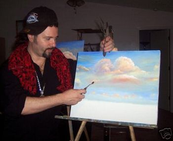 Mazz using the Palette Knife to paint clouds in an Oil Painting
