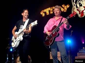 Buzz picking with Brian Setzer on stage in Brussells.
