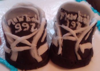 Fondant baby shoes made for sports themed cake
