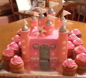 Princess castle cake with cupcakes

