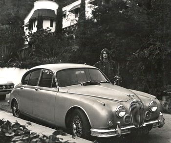 1969 with my '62 MK II Jag. Hollywood Hills in L.A. on North Crescent Heights Blvd. Across the street and in front of my house with Dennis Hopper's house in the background. Nice to have crazy neighbors :o)
