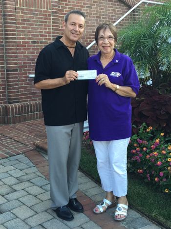 Sol's first donation to the Alzheimer's association in 2015 with Sarah Gilmour
