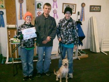 Basic graduate "Murphy" with family and instructor Scott Hurley, December 2011
