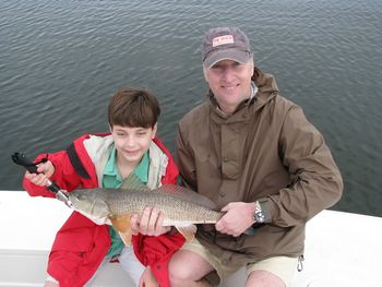 Henry and his father Jim with a nice redfish in Cedar Key.
