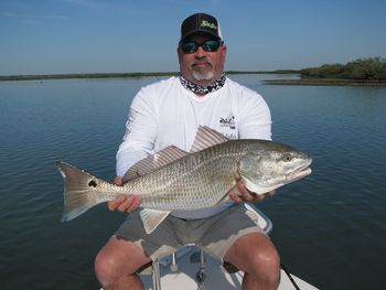Capt. Mark with a huge redfish caught out of Mosquito Lagoon
