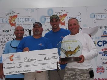Troy, Capt. Mark, and Randy with their 1st place trophy for the Reeling For Kids tournament June 2012 Steinhatchee

