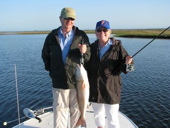 Husband and wife teamed up to boat this 8lb monster redfish in Cedar Key, Florida on topwater
