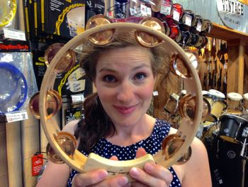 Having fun at The Guitar Center with this fabulous tambourine. Thanks to the $100 price tag we left it in the store...
