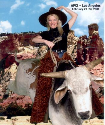 Cathy riding a bull in LA Conference
