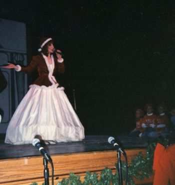 as Mother Christmas, singing "White Christmas" at the Boulder Theater Christmas Gala
