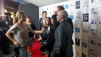 Pat answering questions on the red carpet.
