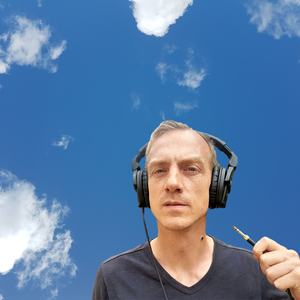 Herman Kuis in the sky with headphones on ready to plug in