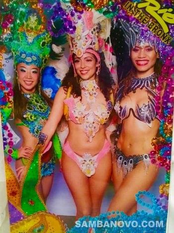 Three beautiful samba dancers for hire with big smiles after performing a very energetic samba show at a private party
