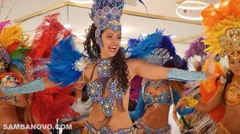 A group of 5 beautiful Brazilian dancers at a party getting guests on their feet to dance, and providing a memorable affair
