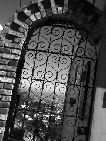 "People Are Strange" The view of Los Angeles through a gate at the edge of a lookout found at Lookout Mountain and Appian Way. This is the spot and the view (although more congested now) that Jim Morrison stood and viewed during a self identified depression, and wrote the lyrics to The Doors’ hit single, “People Are Strange.”
