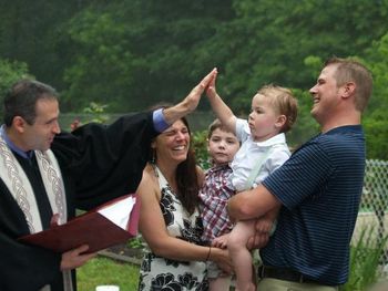 As I blessed Jack at his 2011 baptism, he unexpectedly slapped me five! (Rockaway, NJ)
