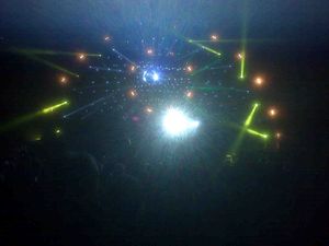 Snap shot from the Brit FLoyd show - lots of scattered lights with disco ball in middle