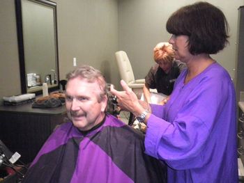 Jack getting his haircut at CTCA when his hair fell out due to radiation treatment.
