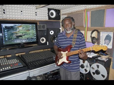 Correl Hewitt inside his studio with a guitar he got as a gift from Rolling Stones' Keith Richards.