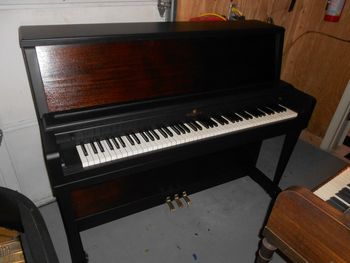 Same Wurlitzer Studio Piano wearing its brand new two tone finish, this is 7 coats of straight black followed by 5 coats of satin clear. New keycovers, polished brass. Very sharp.
