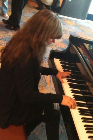 Mrs. Baker (Lisa LaRue) plays the piano at NAMM 2012
