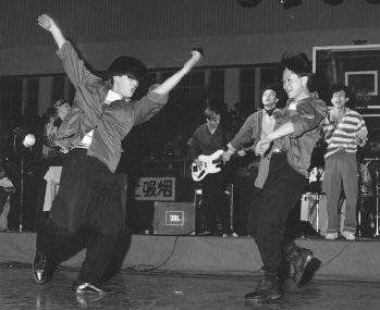 The Vagaries with audience dancers, Kunming National Defense Arena 1991; photo by Spike Mafford
