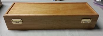 Case in Maple with a light stain. Old style latches.
