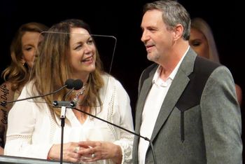 Donna Ulisse and Glen Harrel accepting 2017 IBMA Song of the Year Award
