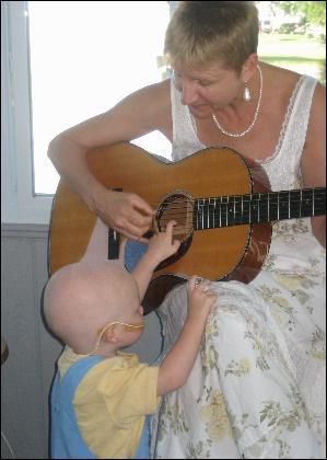 Singing for Chase on his 2nd Birthday Mentoring a future guitarist! Brigantine Beach, NJ Spring 2007
