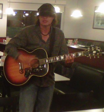 Playing guitar for employees at a Denny's restaurant, 3 a.m.
