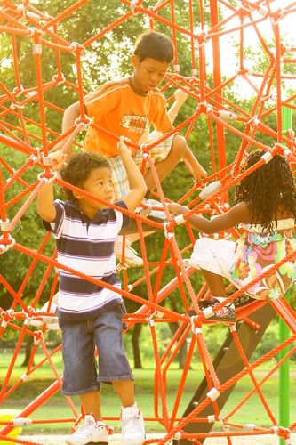 The kids are playing on the spider web designed by Playworld systems!!
