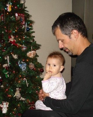 Daddy's showing her the tree.
