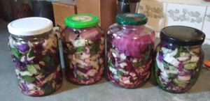 Fermenting cabbage and other vegetables in odd shaped glass jars