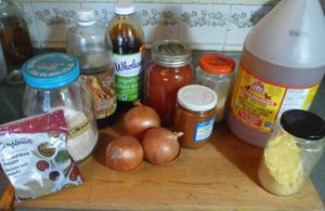 supplies for making vegan beans in odd shaped glass jars